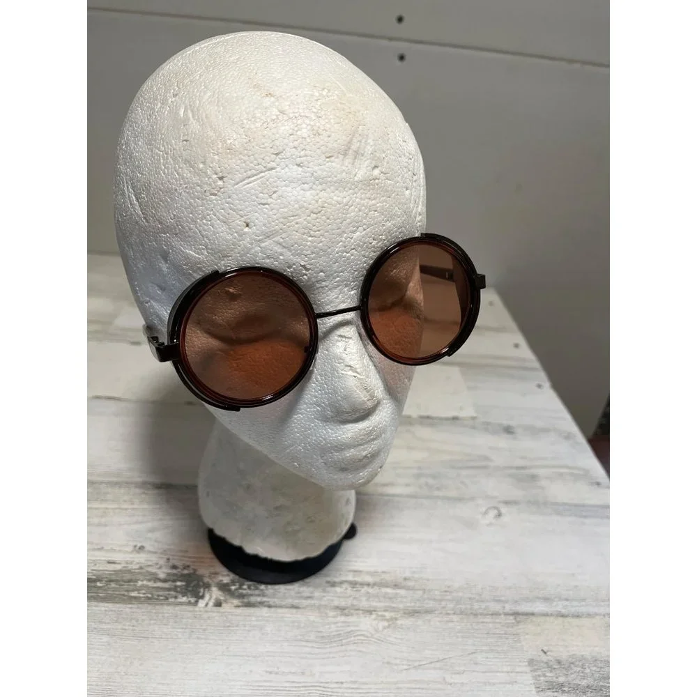 Glasses round amber tinted with black case